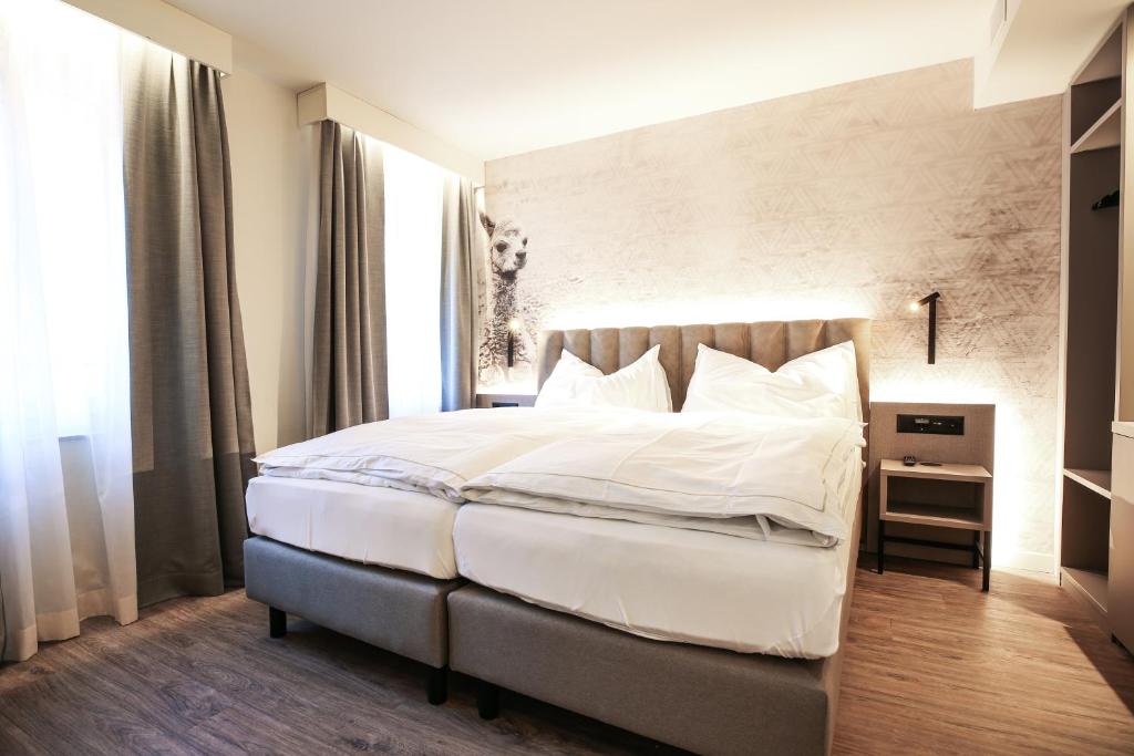 Postel nebo postele na pokoji v ubytování Adaastra Boutique Hotel