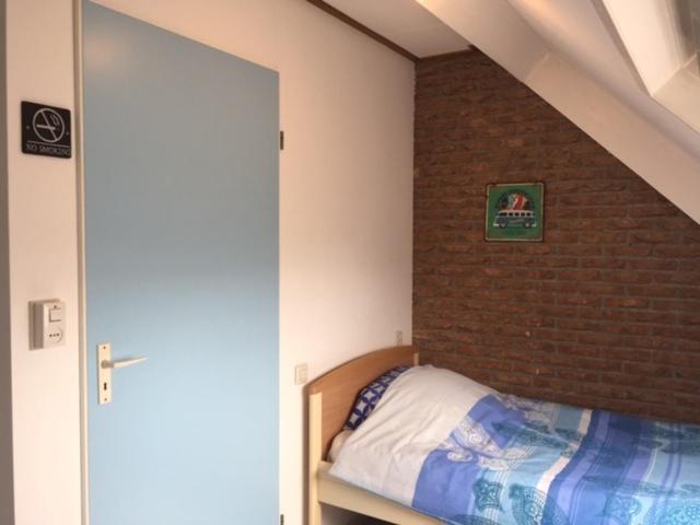 Postel nebo postele na pokoji v ubytování B&B Kogervennetje