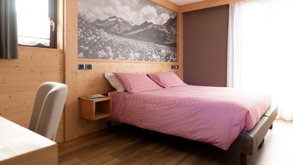 Postel nebo postele na pokoji v ubytování Hotel Compagnoni