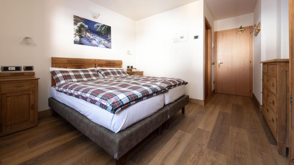 Postel nebo postele na pokoji v ubytování Hotel Compagnoni