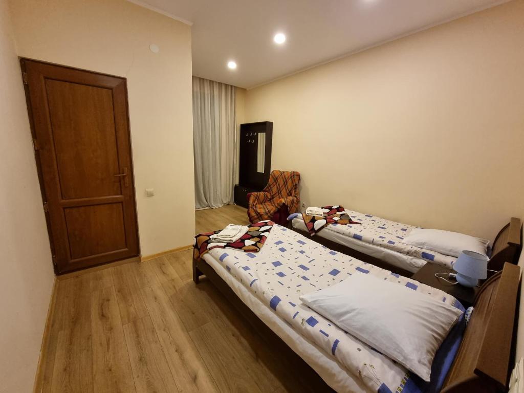 Postel nebo postele na pokoji v ubytování Shorena & Nino