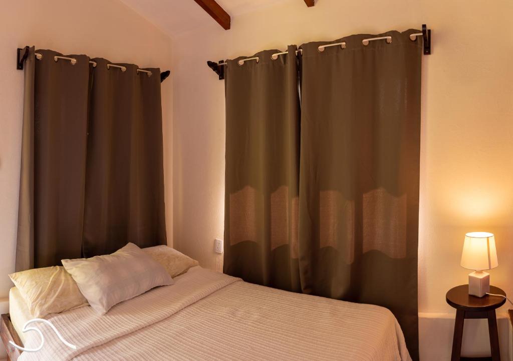 Postel nebo postele na pokoji v ubytování Tranquilidad Resort