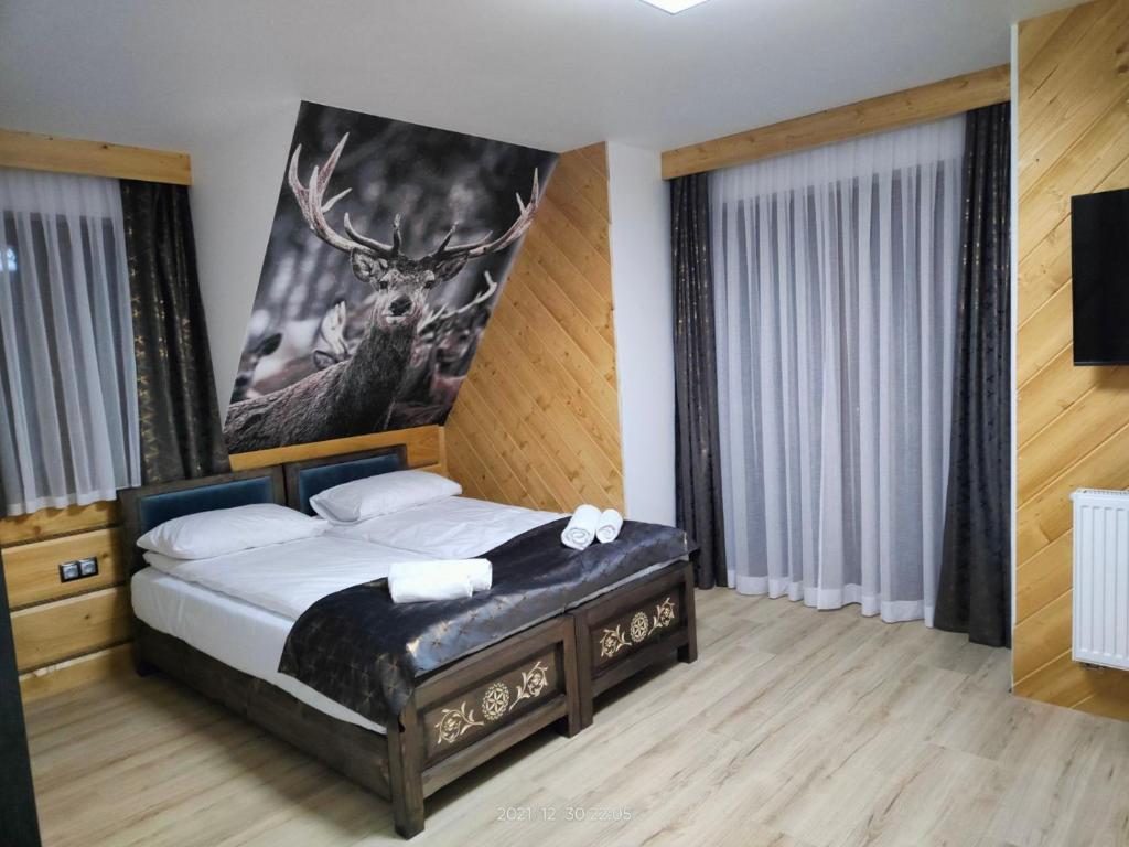 Postel nebo postele na pokoji v ubytování Willa Bafijówka