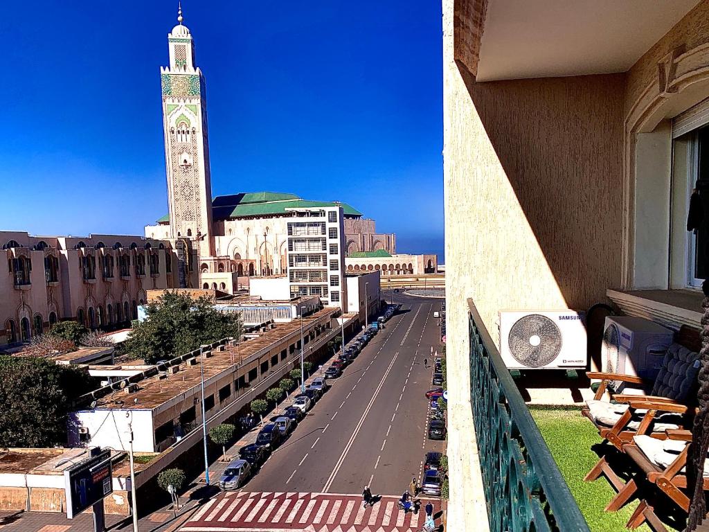 a view of a city with a clock tower at Sab 14 - Amazing Views Of The Mosque Hassan. Comfy 2 Bedrooms - Super well located in Casablanca