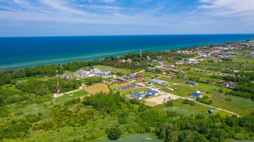 an aerial view of a park next to the ocean at Domki Asgard in Gąski