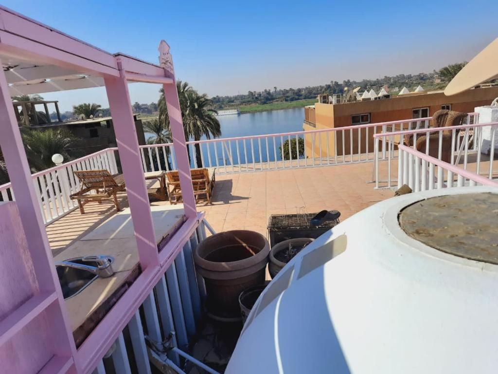 A balcony or terrace at East Luxor Apartments with Nile views
