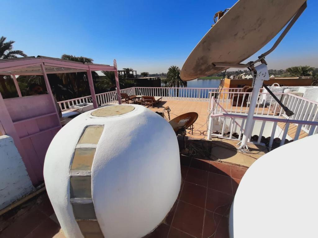 A balcony or terrace at East Luxor Apartments with Nile views