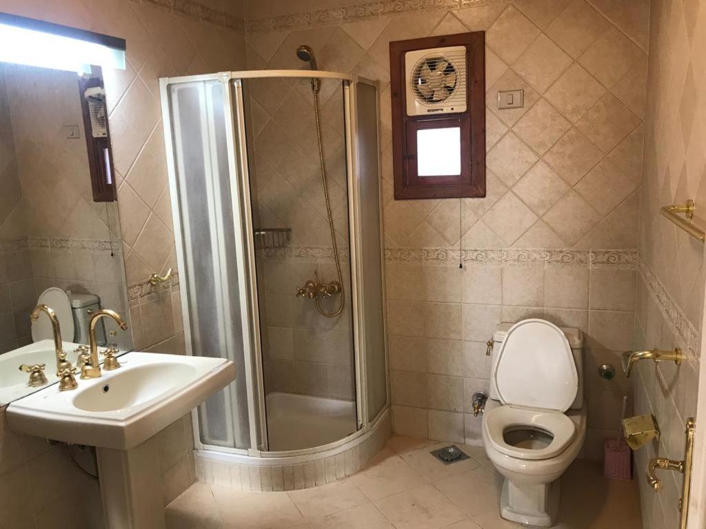 A bathroom at East Luxor Apartments with Nile views