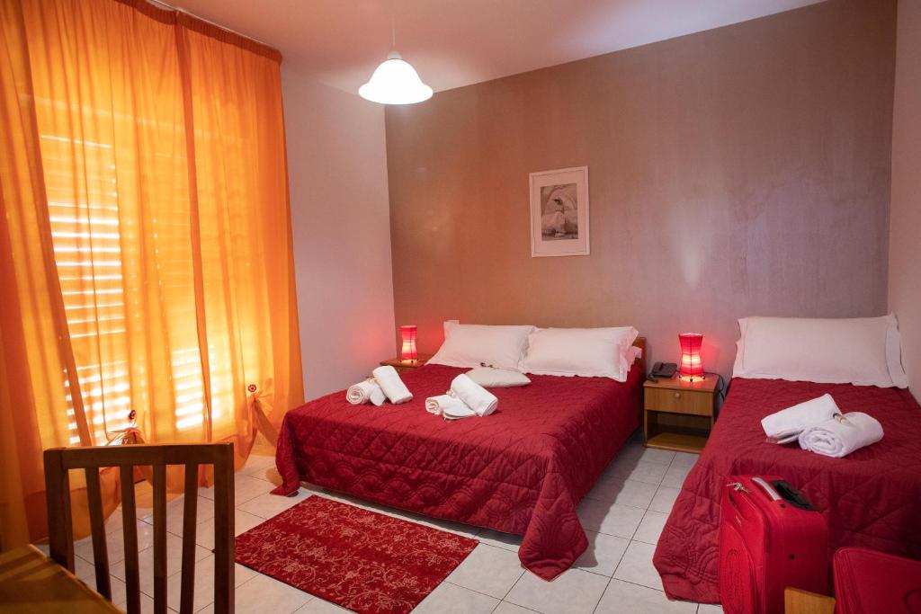 A bed or beds in a room at Hotel Kiris