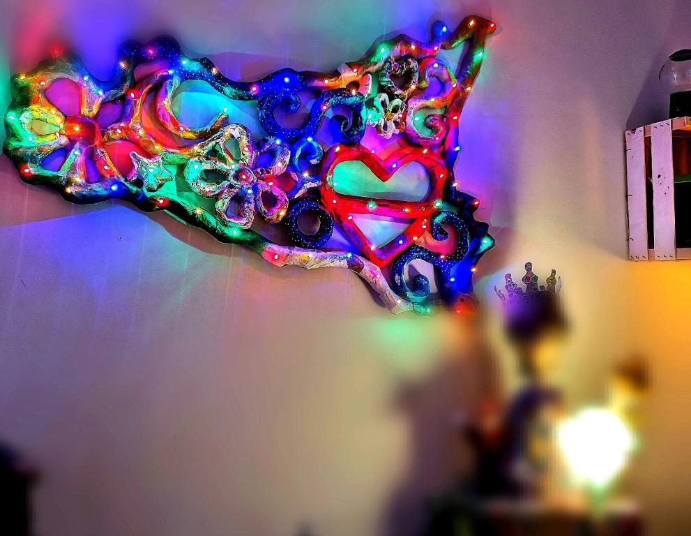 a colorful glass star is hanging on a wall at La Dimora del Principe - Appartamento in Catania