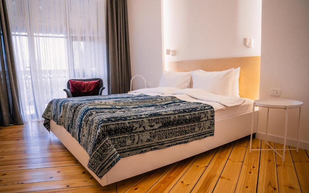 Postel nebo postele na pokoji v ubytování Dilijani Tun Hotel & Restaurant