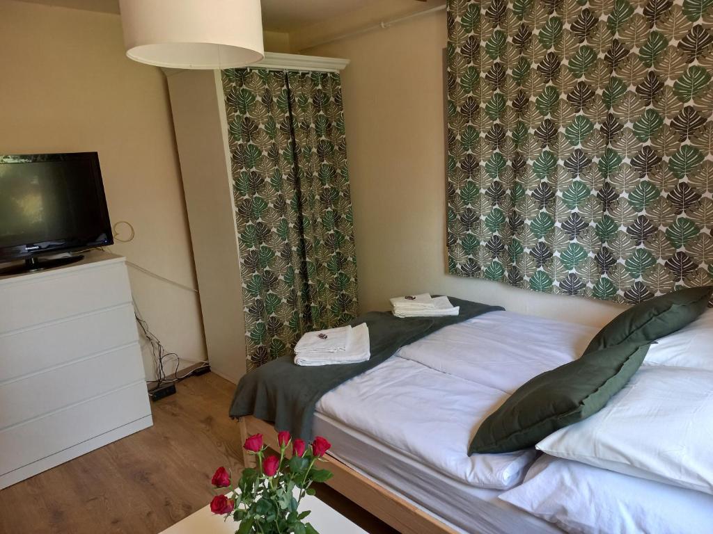 Postel nebo postele na pokoji v ubytování Háromfenyő Apartman