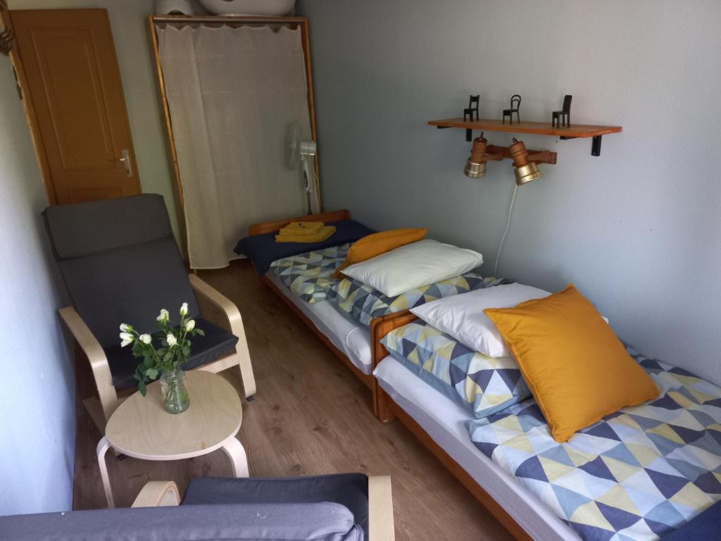 Postel nebo postele na pokoji v ubytování Háromfenyő Apartman