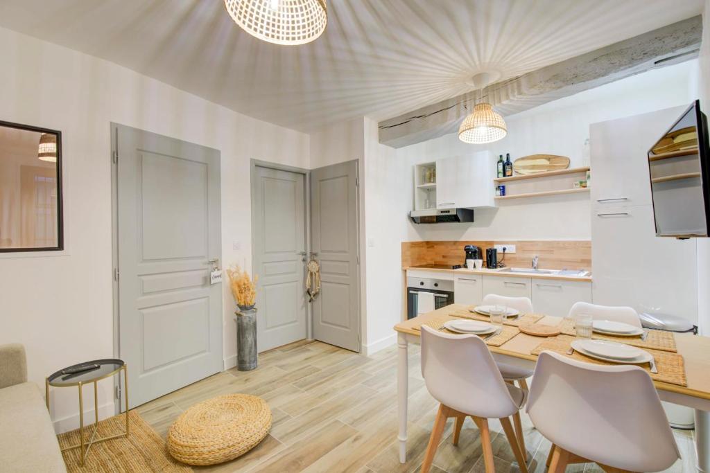 a kitchen and dining room with a table and chairs at Le Langeais Cocoon in the heart of Les Halles in Tours