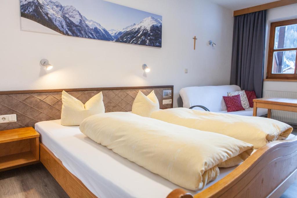 Postel nebo postele na pokoji v ubytování Sonnenhof - Apartments & Zimmer