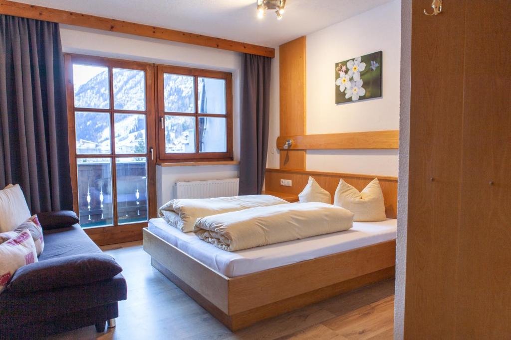 Postel nebo postele na pokoji v ubytování Sonnenhof - Apartments & Zimmer