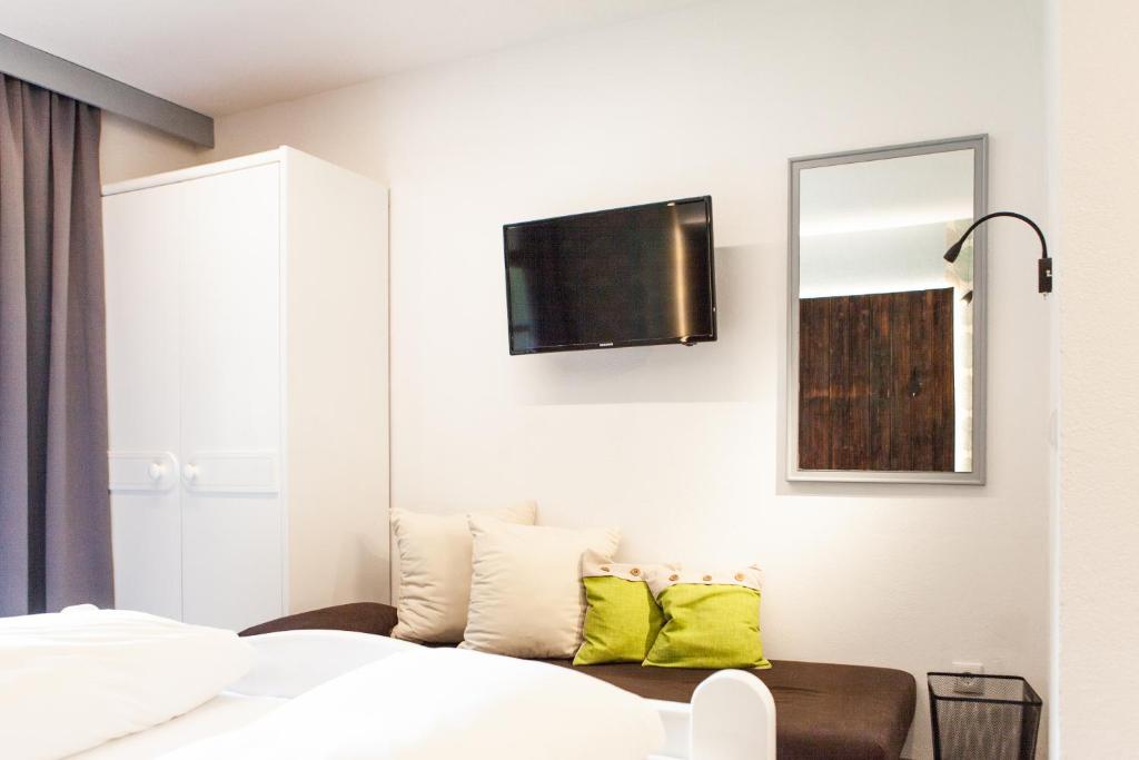 Postel nebo postele na pokoji v ubytování Sonnenhof - Apartments & Zimmer