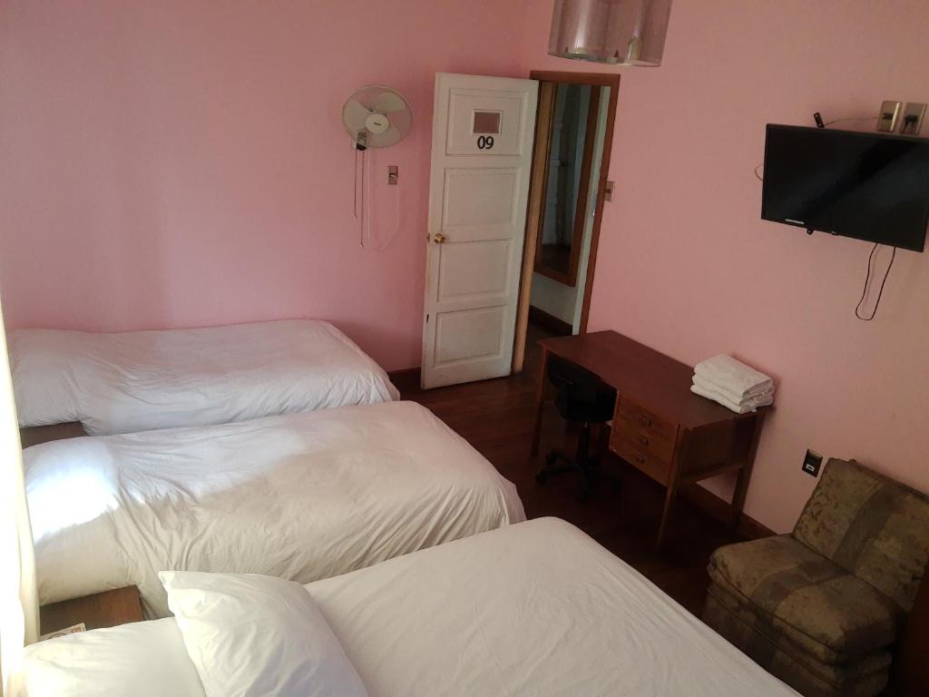 Postel nebo postele na pokoji v ubytování Hotel Cordillera