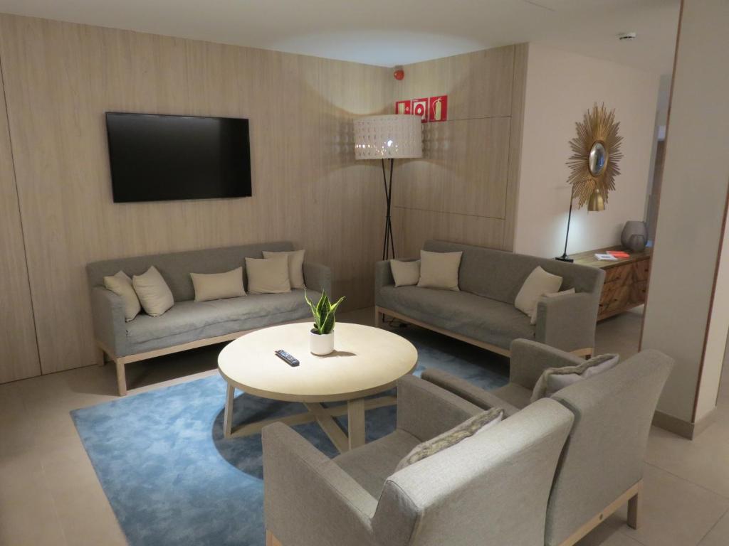 TV a/nebo společenská místnost v ubytování Hotel Omnium