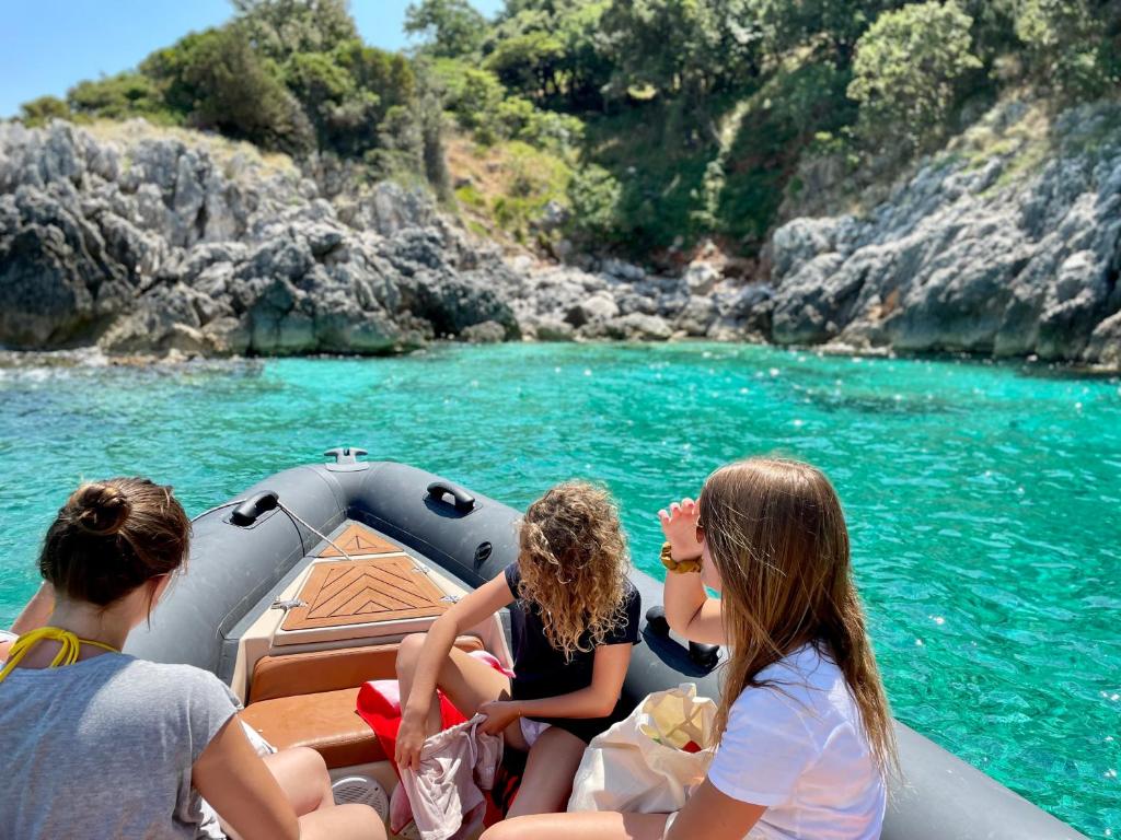 a group of people on a boat in the water at ELMAR HOTEL in Vlorë