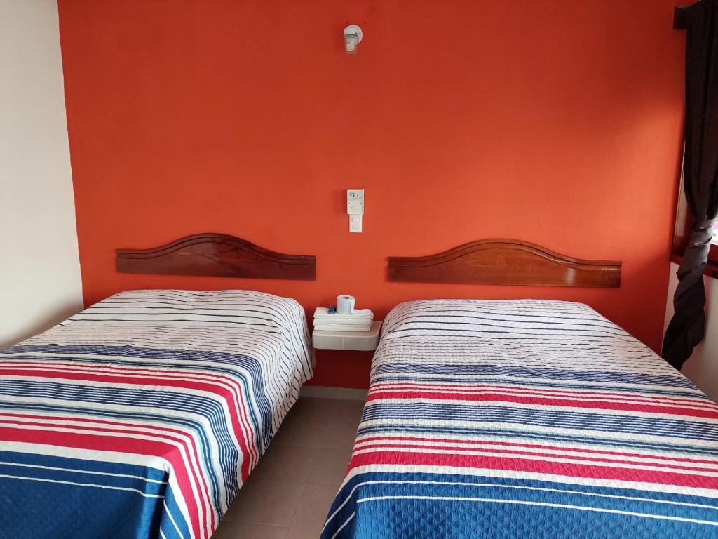 Postel nebo postele na pokoji v ubytování Posada Casa Bugambilias