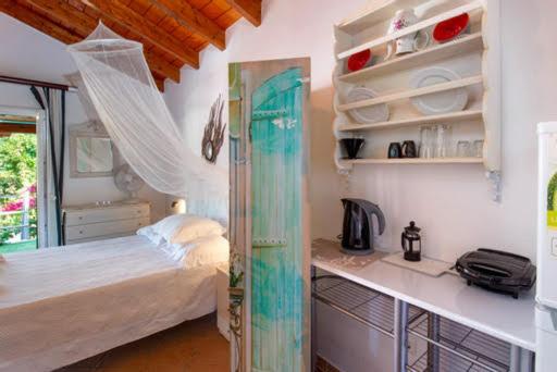 Postel nebo postele na pokoji v ubytování Nandia Studio & Apartment