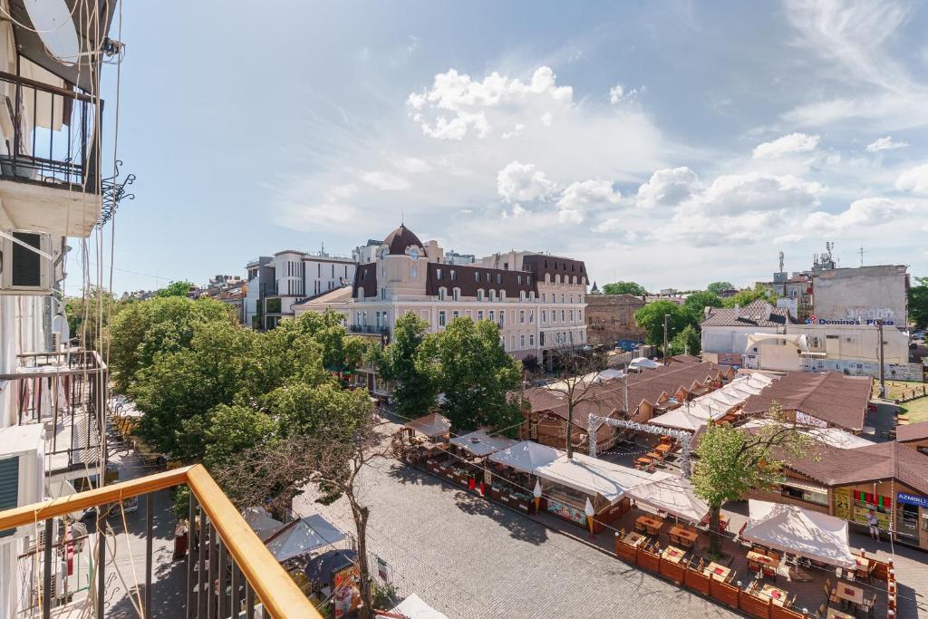 an aerial view of a town with a train at 20 Deribasivska 2 bedrooms Apartment in Odesa