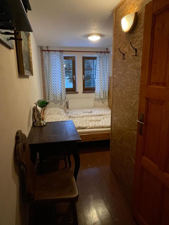 Postel nebo postele na pokoji v ubytování Hepnarova Bouda