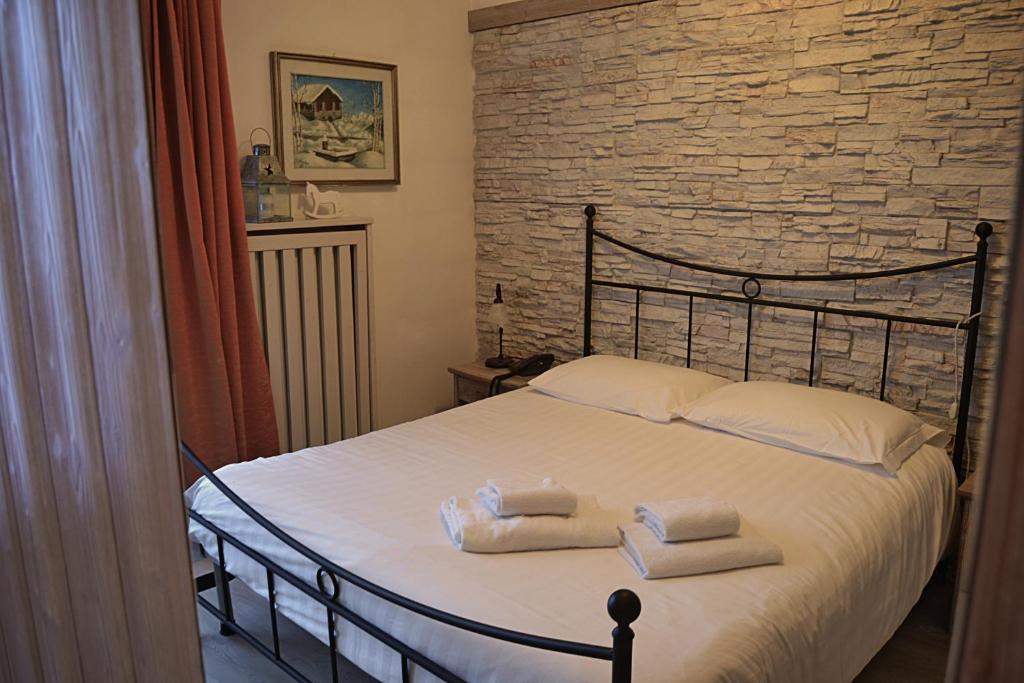 Postel nebo postele na pokoji v ubytování Hotel Cova