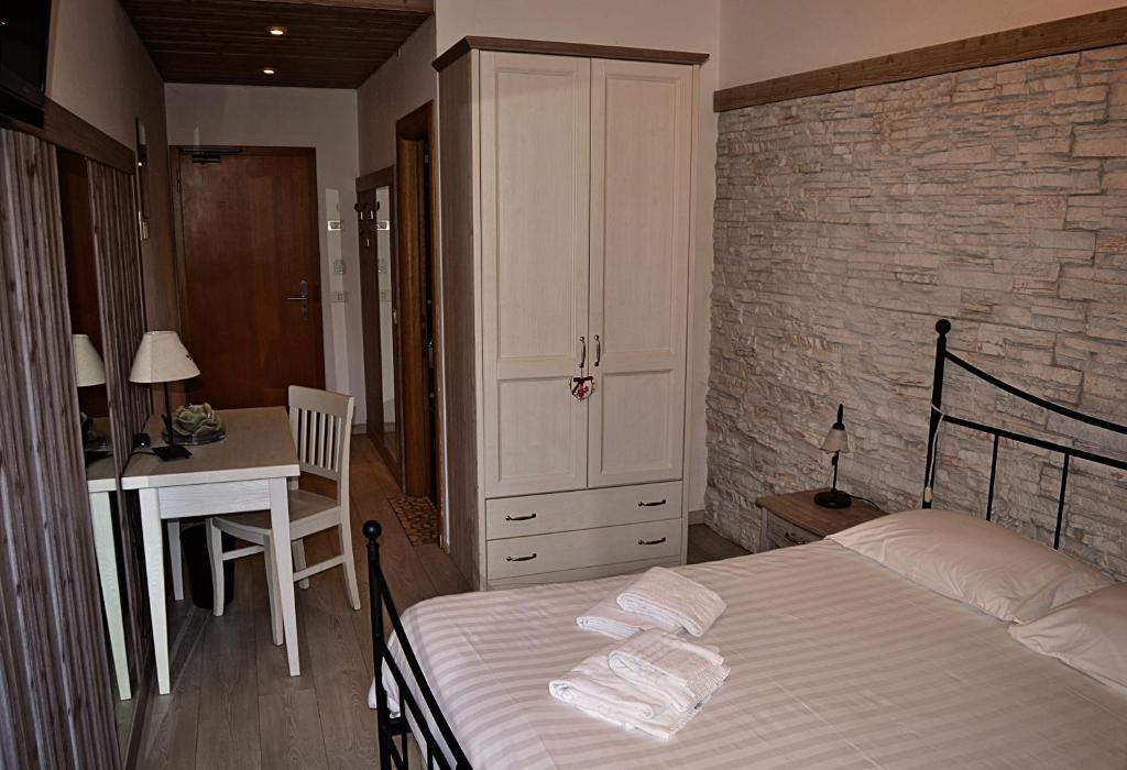 Postel nebo postele na pokoji v ubytování Hotel Cova
