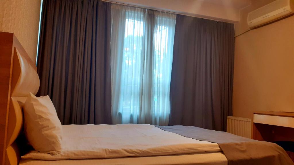 Postel nebo postele na pokoji v ubytování Hotel Lile
