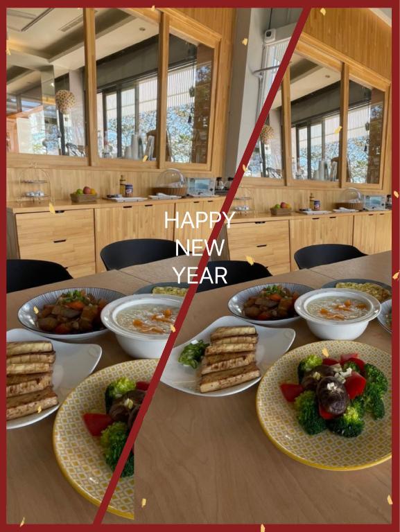 a table with plates of food and a happy new year sign at Lutai B&amp;B in Yung-an-ts&#39;un