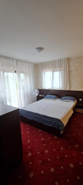 Säng eller sängar i ett rum på Vila NICHOLAS