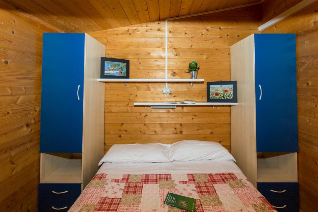 A bed or beds in a room at Club del Sole Marina Romea Easy Camping Village