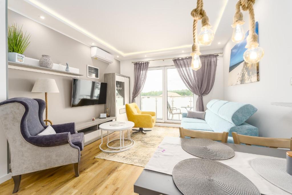 Televízia a/alebo spoločenská miestnosť v ubytovaní Sunset Resort II, Nadmorska 104