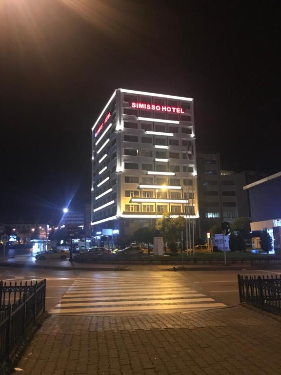 a building with a sign on it at night at SİMİSSO HOTEL in Samsun