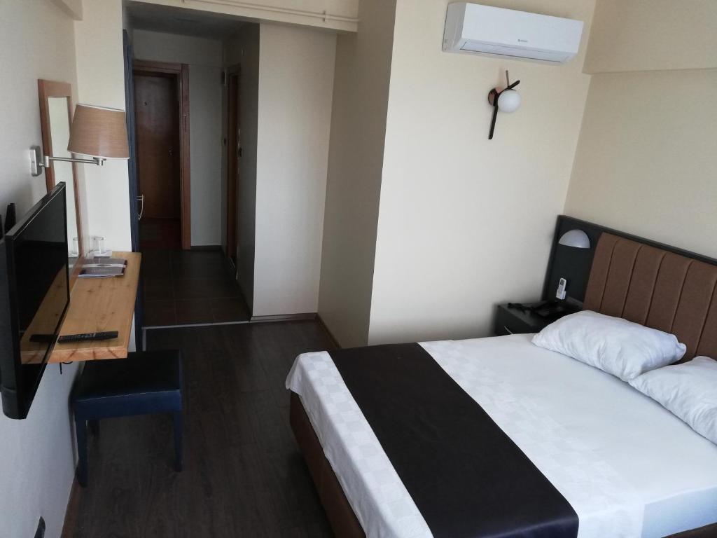 Postel nebo postele na pokoji v ubytování SİMİSSO HOTEL