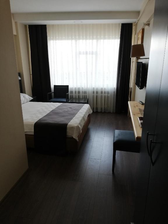 Postel nebo postele na pokoji v ubytování SİMİSSO HOTEL