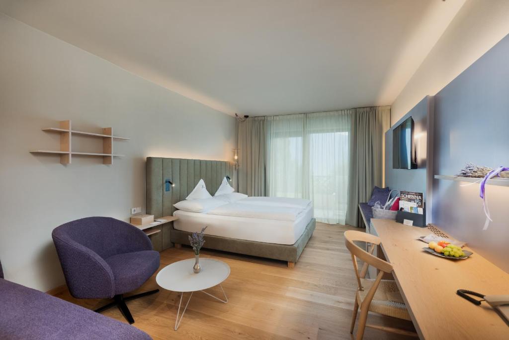 Postel nebo postele na pokoji v ubytování Hotel Lagrein