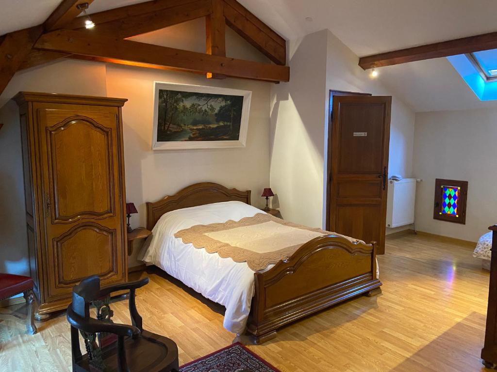 מיטה או מיטות בחדר ב-La Maison d'Euterpe