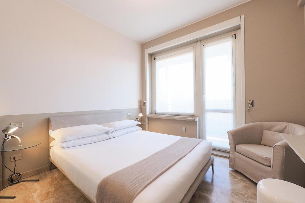 Łóżko lub łóżka w pokoju w obiekcie Contempora Apartments - Elvezia 8 - E52