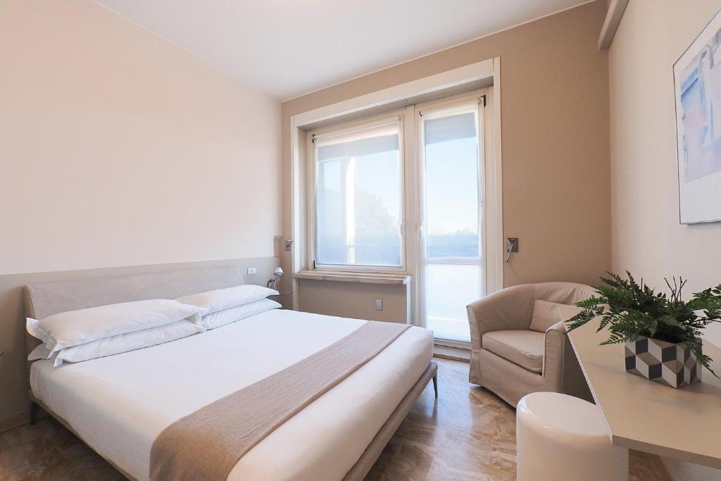 Łóżko lub łóżka w pokoju w obiekcie Contempora Apartments - Elvezia 8 - E52