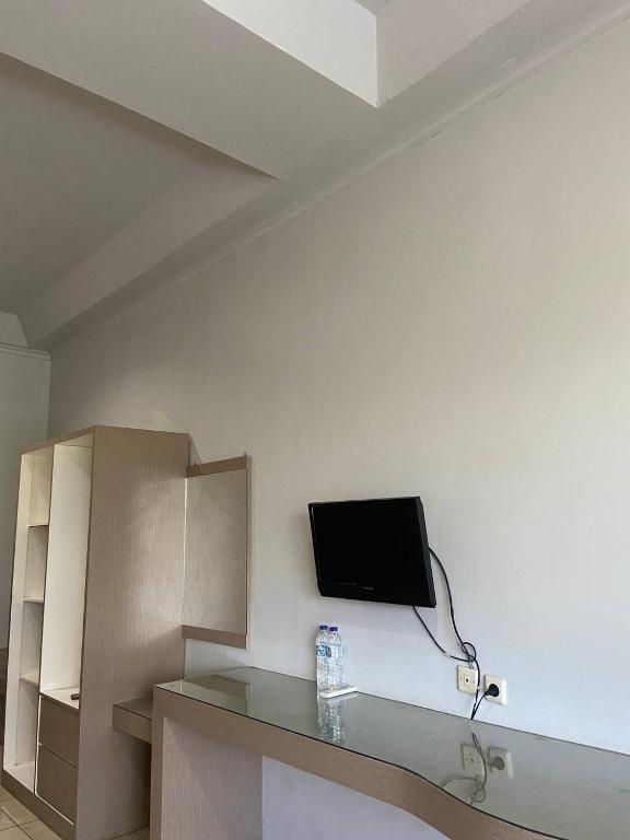 TV a/nebo společenská místnost v ubytování Hotel Pesona Merak