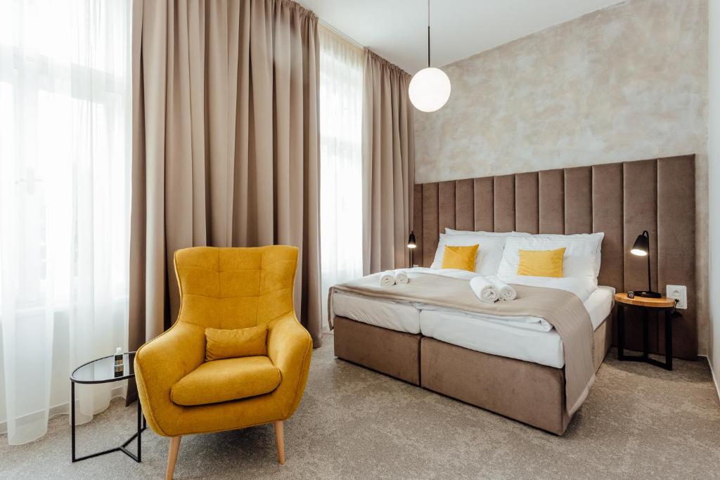 A bed or beds in a room at Boutique Hotel Siglisberg