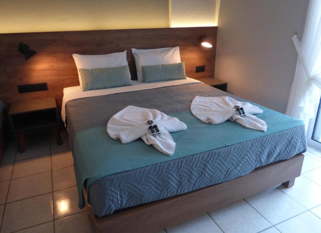 Postel nebo postele na pokoji v ubytování Poledas Apartments