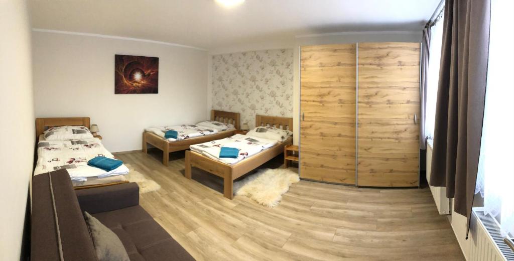 Postel nebo postele na pokoji v ubytování U Fousáče