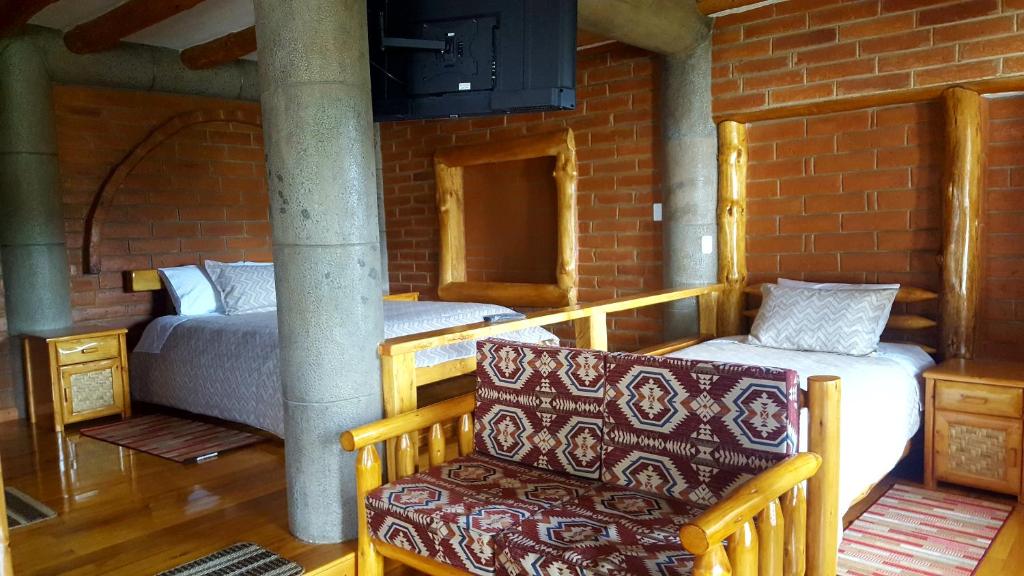 Postel nebo postele na pokoji v ubytování ATALLARO Hospedaje