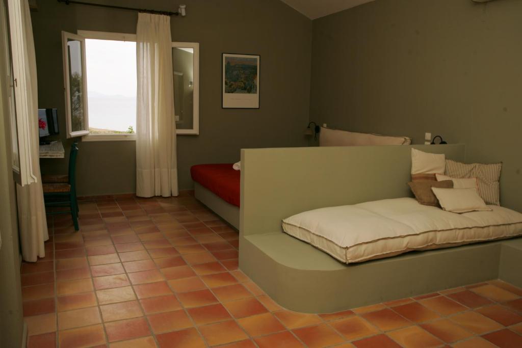 Postel nebo postele na pokoji v ubytování Mounda Beach Hotel