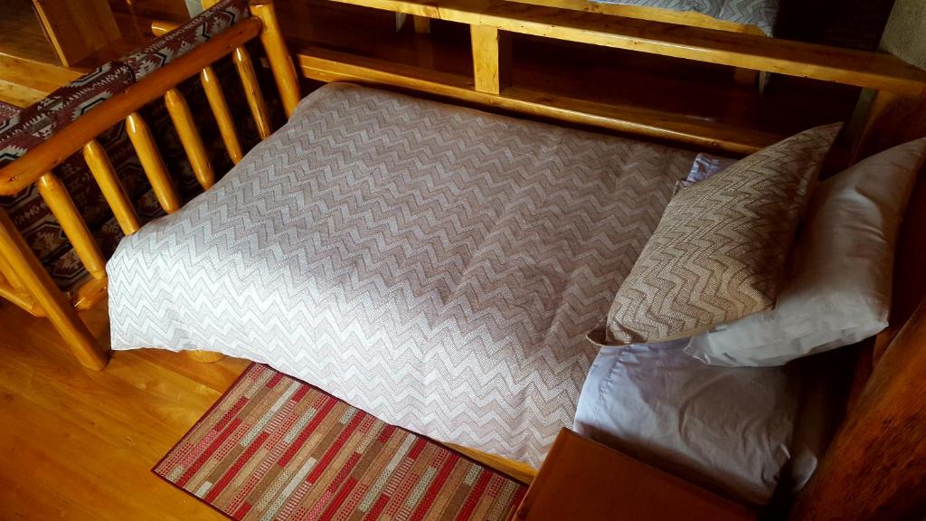 Postel nebo postele na pokoji v ubytování ATALLARO Hospedaje
