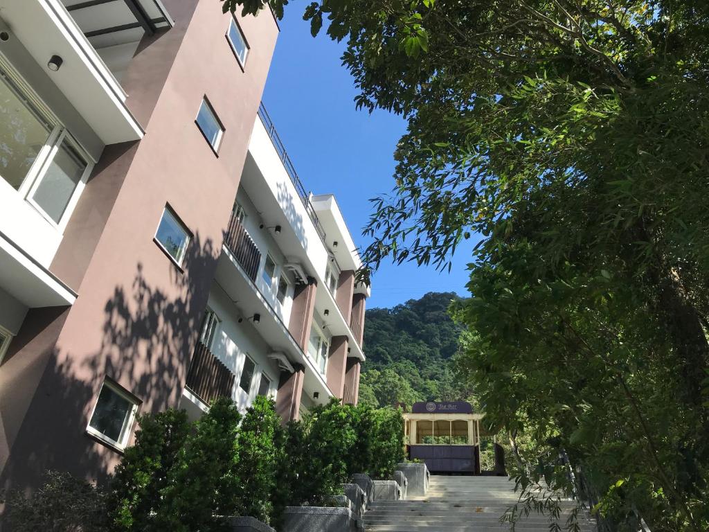a view of a building next to a street at Sla Ulay in Wulai